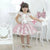 Girl’s floral dress with pink tulle on the skirt + Hair Bow - Dress